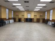View from front french doors of main room including two exterior doors and two kitchen doors.