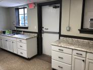 View of kitchen exterior wall with exterior door.