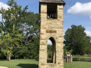 Volunteers constructed this stone bell tower to display the original bell donated by the congregation of China Chapel.